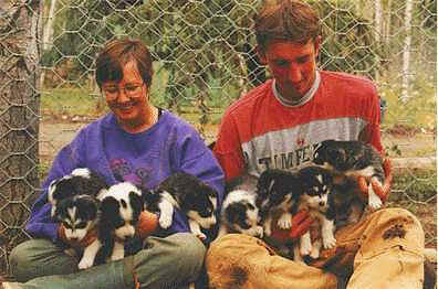 Anne Tayler with puppies