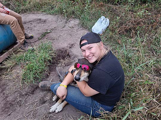 Mushing Club at Michigan Tech Vice President Brynn Santi having fun with the Alaskan Husky Storm while caring for the dogs at Otter River Sled Dog Training Center and Wilderness Adventures. | Article/Image: Ben Garbacz, Daily Mining Gazette Mushing Club at Michigan Tech Vice President Brynn Santi having fun with the Alaskan Husky Storm while caring for the dogs at Otter River Sled Dog Training Center and Wilderness Adventures. | Article/Image: Ben Garbacz, Daily Mining Gazette