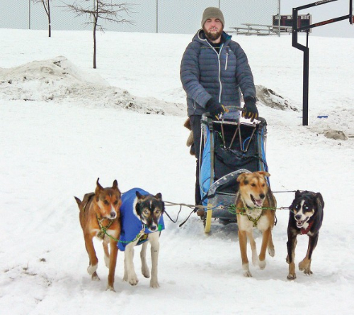 GRETCHEN MENSINK LOVEJOY/CHATFIELD NEWS Damon Ramaker of Wykoff takes his dogs for a run around the schoolyard to show the students what it