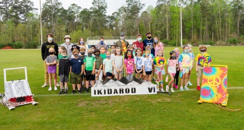 The Class of 2031 and Foundations of Innovation class pose for a quick picture post Ikidarod relay.