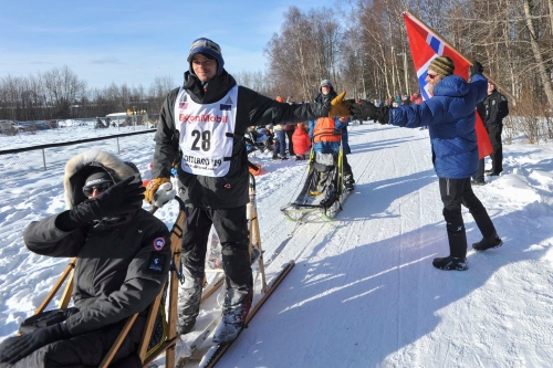 Defending champion Joar Leifseth Ulsom is greeted by local fan Ole Andersson during the ceremonial start of the Iditarod Trail Sled Dog Race Saturday, March 2, 2019 in Anchorage, Alaska. (Michael Dinneen/Associated Press) Defending champion Joar Leifseth Ulsom is greeted by local fan Ole Andersson during the ceremonial start of the Iditarod Trail Sled Dog Race Saturday, March 2, 2019 in Anchorage, Alaska. (Michael Dinneen/Associated Press)