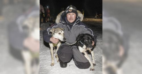 Greg Larson of Napaskiak poses with his lead dogs at the finish line after winning the 2016 Akiak Dash sled dog race. CREDIT CHRIS PIKE / KYUK
