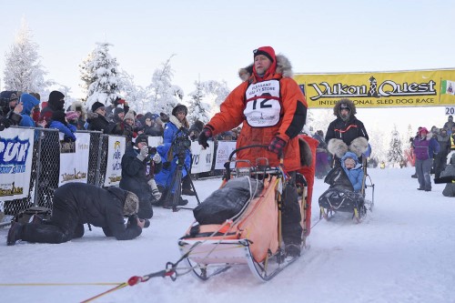 Rob Cooke starts the Yukon Quest at the Morris Thompson Cultural and Visitors Center in Fairbanks, Alaska, on Feb. 1. Cooke said simply holding a race this year is a “light for us at the end of the tunnel.” (John Hopkins-Hill/Yukon News file)