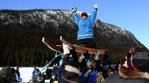Carl Rumbolt was lifted on his sled after coming in first at the Eric Rumbolt Memorial Sled Dog Race in Port Hope-Simpson on March 19, 2022. (Heidi Atter/CBC) Carl Rumbolt was lifted on his sled after coming in first at the Eric Rumbolt Memorial Sled Dog Race in Port Hope-Simpson on March 19, 2022. (Heidi Atter/CBC)